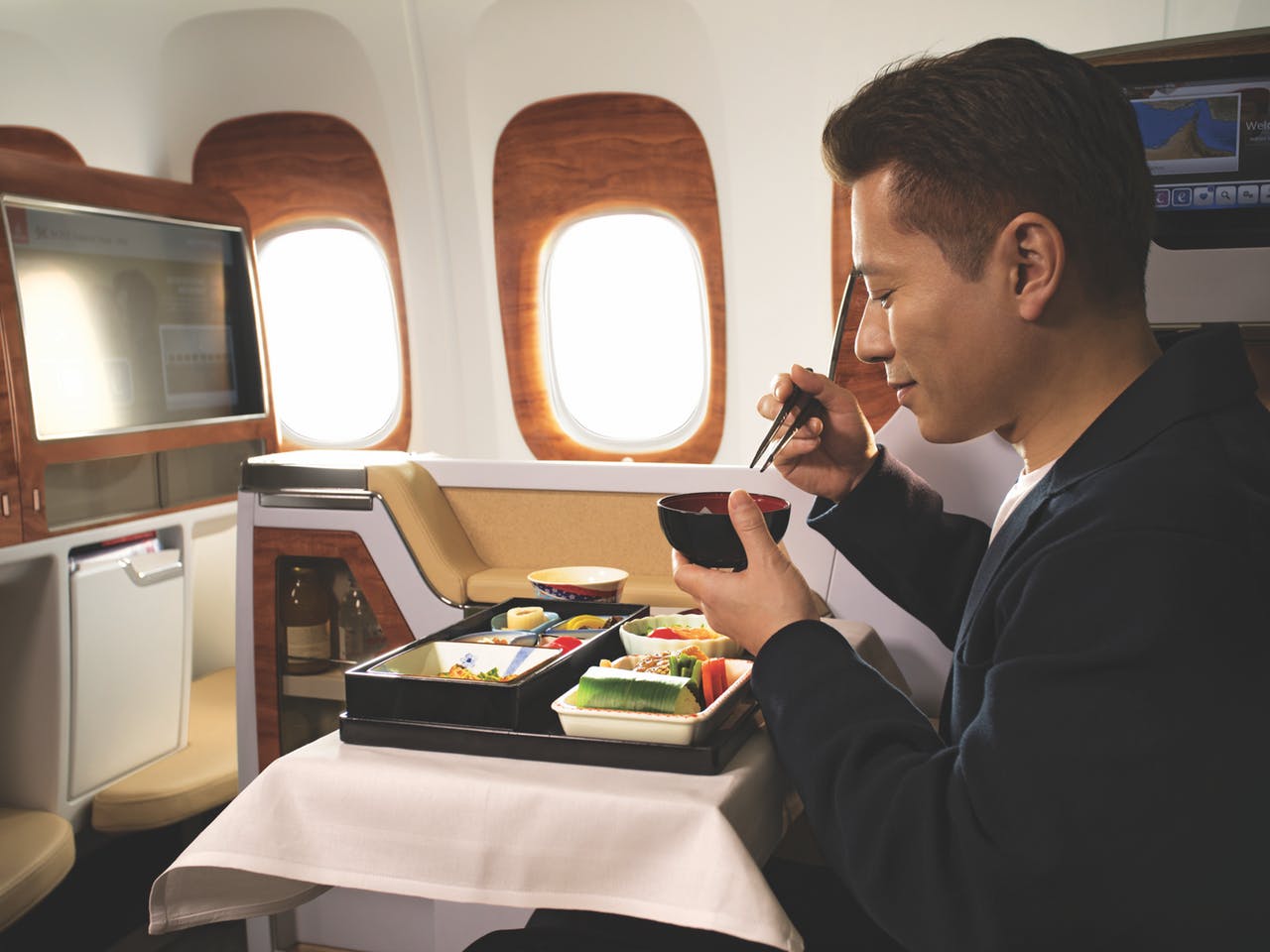 Business Class: Sink into your spacious seat with a drink from your mini-bar. You can select a movie using your touchscreen tablet controller and dine on regionally inspired multicourse meals matched with fine wines. Join the conversation over cocktails in the A380 Onboard Lounge. When it's time to sleep, you can recline your seat into lie-flat comfort with a mattress. Freshen up with a Bvlgari amenity kit on longer journeys.