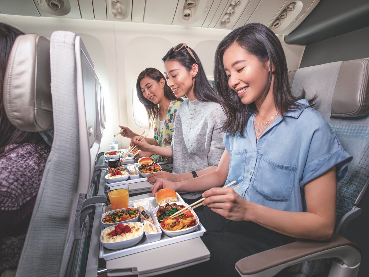 Economy Class: Experience an Economy Class that feels like an upgrade. Enjoy extra space and relaxing ambient lighting. Dine on gourmet cuisine with the flavors of your destination or a comforting taste of home. It's all complemented by a range of wines, beers, spirits, and soft drinks.