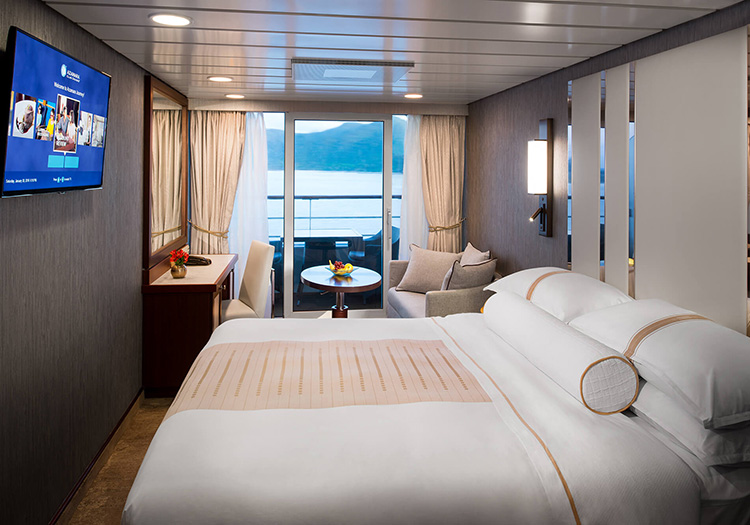 Stateroom bedroom and balcony aboard 5-Star cruise