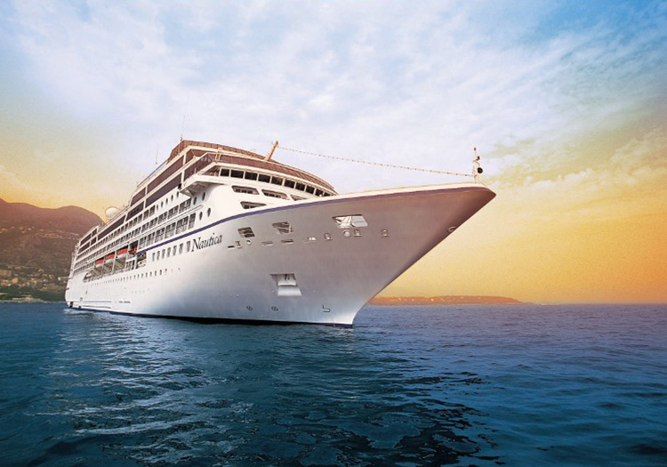 Luxurious Oceania Cruises Nautica ship at sunset