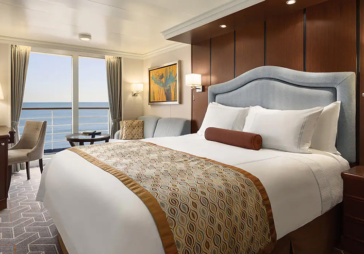 Stateroom bedroom and balcony aboard Oceania Cruises