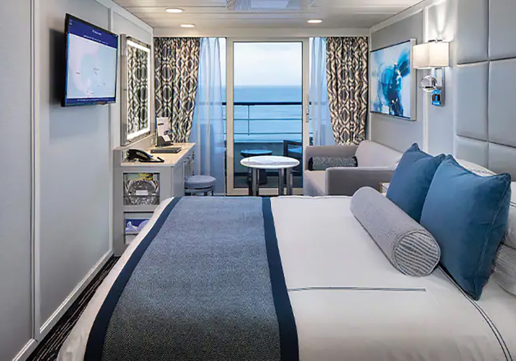 Modern bedroom and balcony cabin on Oceania Cruises ship