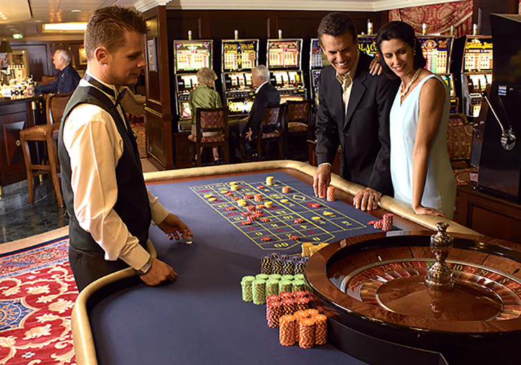 Couple playing roulette at casino