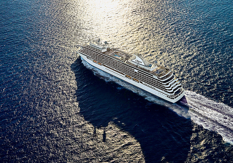 Cruise ship gliding through the sea on a sunny afternoon